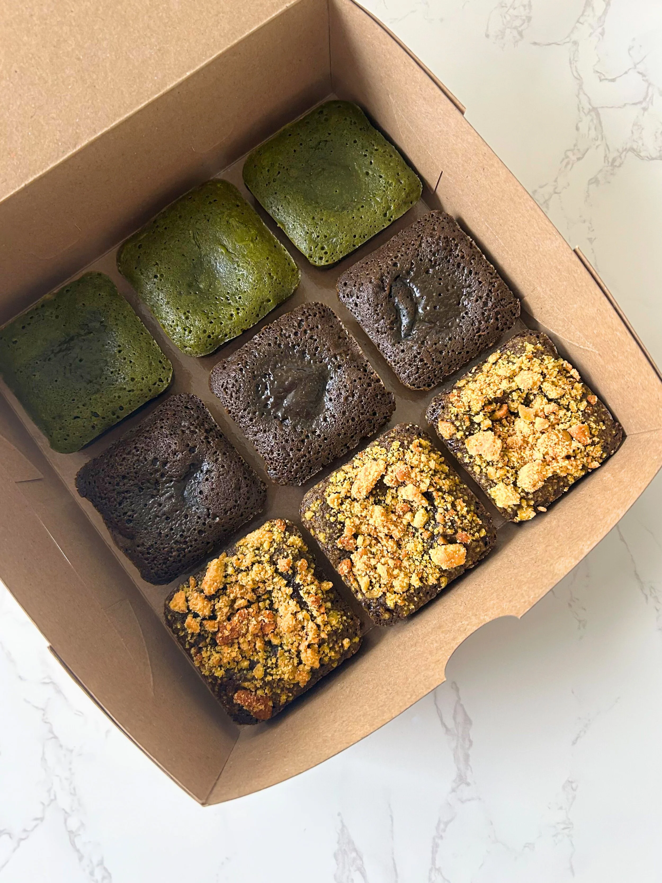 Assorted fudgy matcha brownies and hojicha brownies from a home-based matcha bakery in Singapore