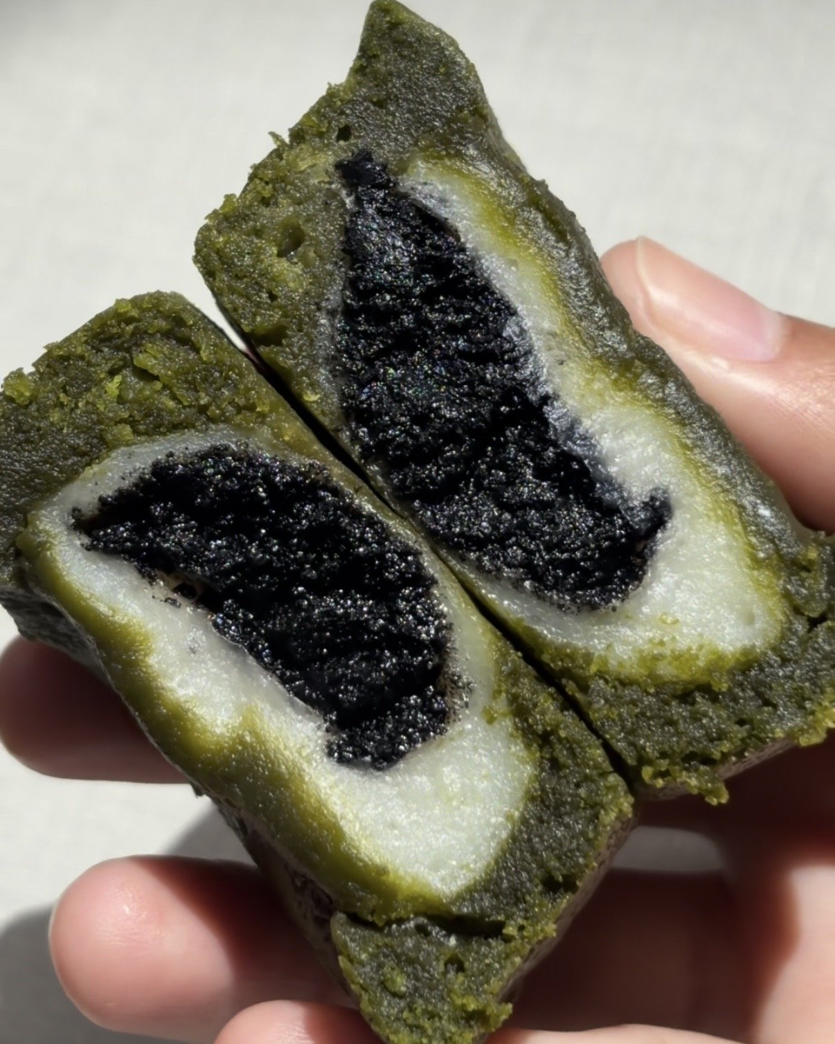 Fudgy matcha black sesame mochi brownie made with ceremonial-grade matcha from a Singapore matcha bakery.