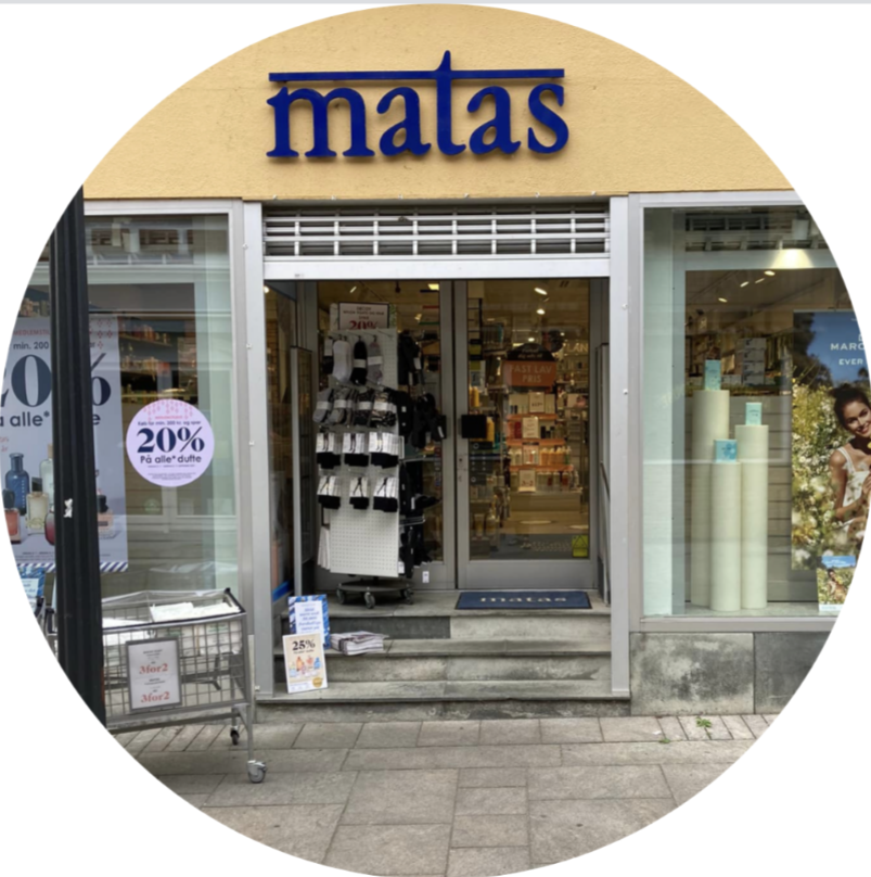 Storefront of Matas, a beauty and health retail store, with open doors and promotional signs.