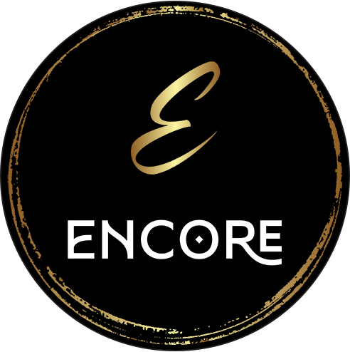 Black circular logo with gold distressed border, gold scripted letter 'E' at the top, and white text 'ENCORE' below.