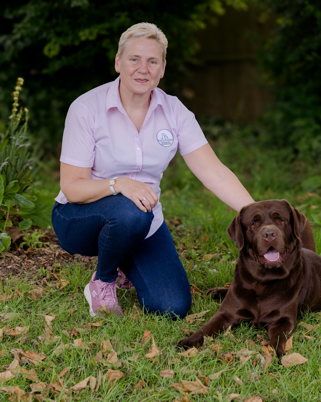 Angela Late, wedding pet chaperone with her Chocolate labrador