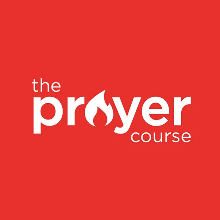 Red background with white text displaying 'the prayer course' with a flame integrated into the letter 'o' in 'prayer'.