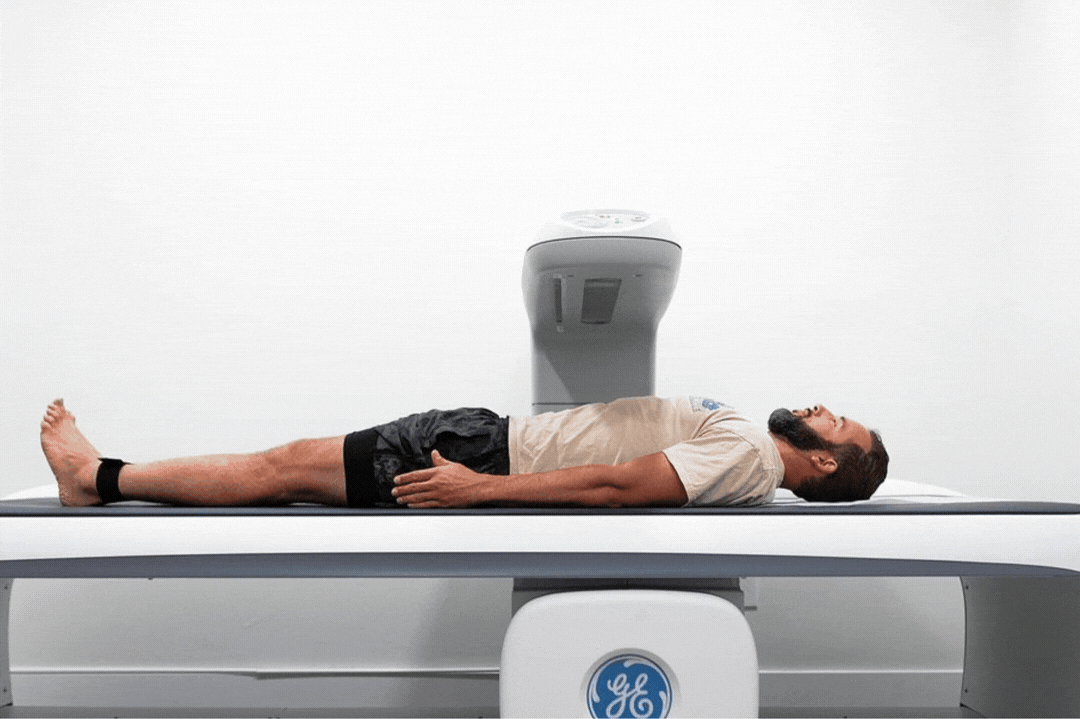 Man performing DexaFit DEXA scan at DexaFit with ai app data