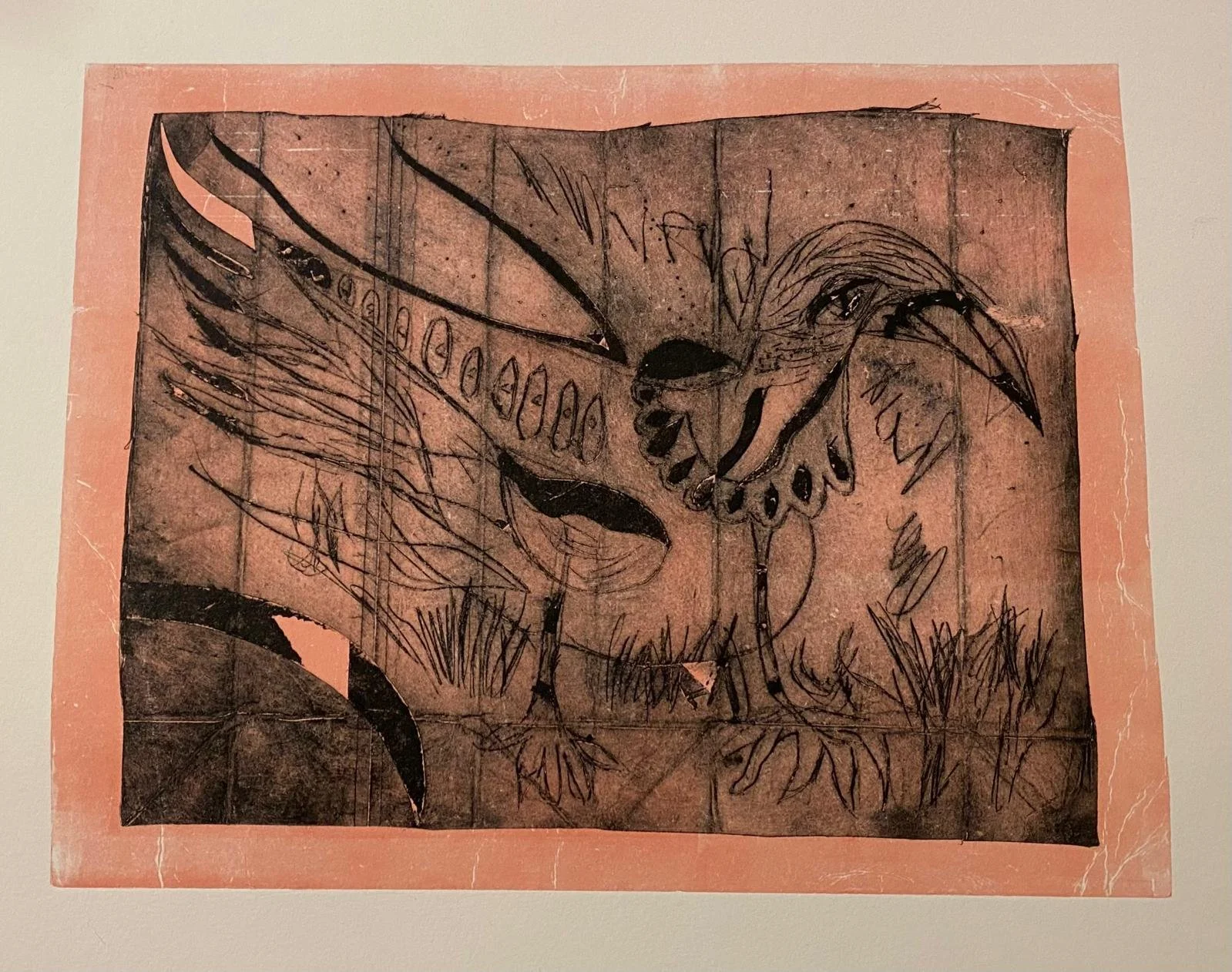 A sketch of a butterfly with detailed wings, sitting on a patch of grass, with rough, expressive lines and a textured background.
