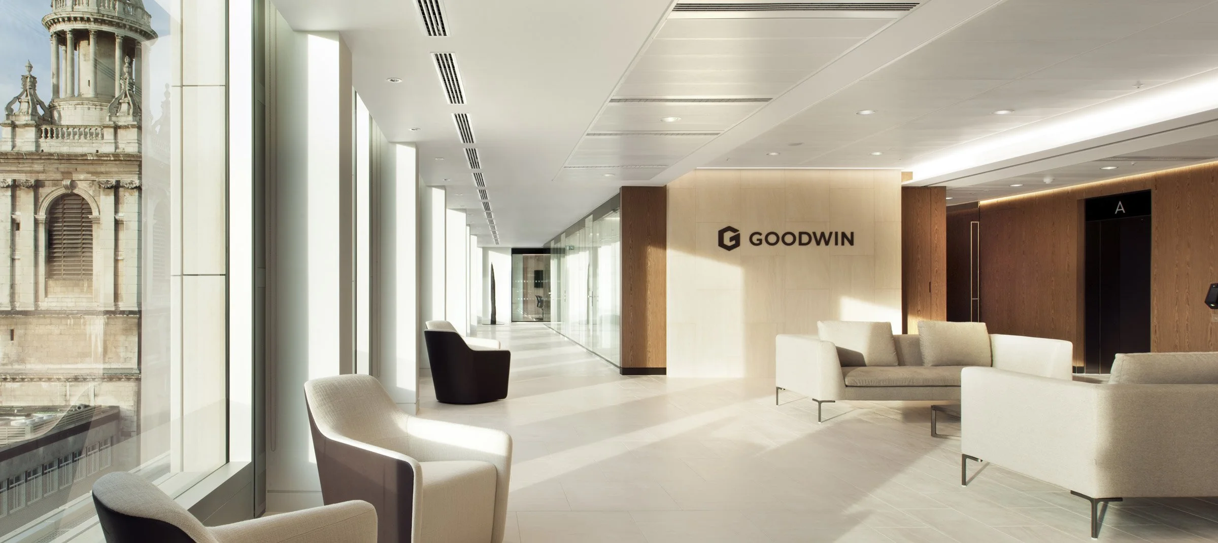 Modern office reception area with large windows.