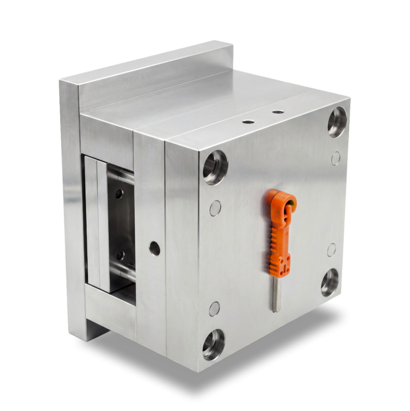 A metallic industrial mold with a small orange handle attached to its front surface.