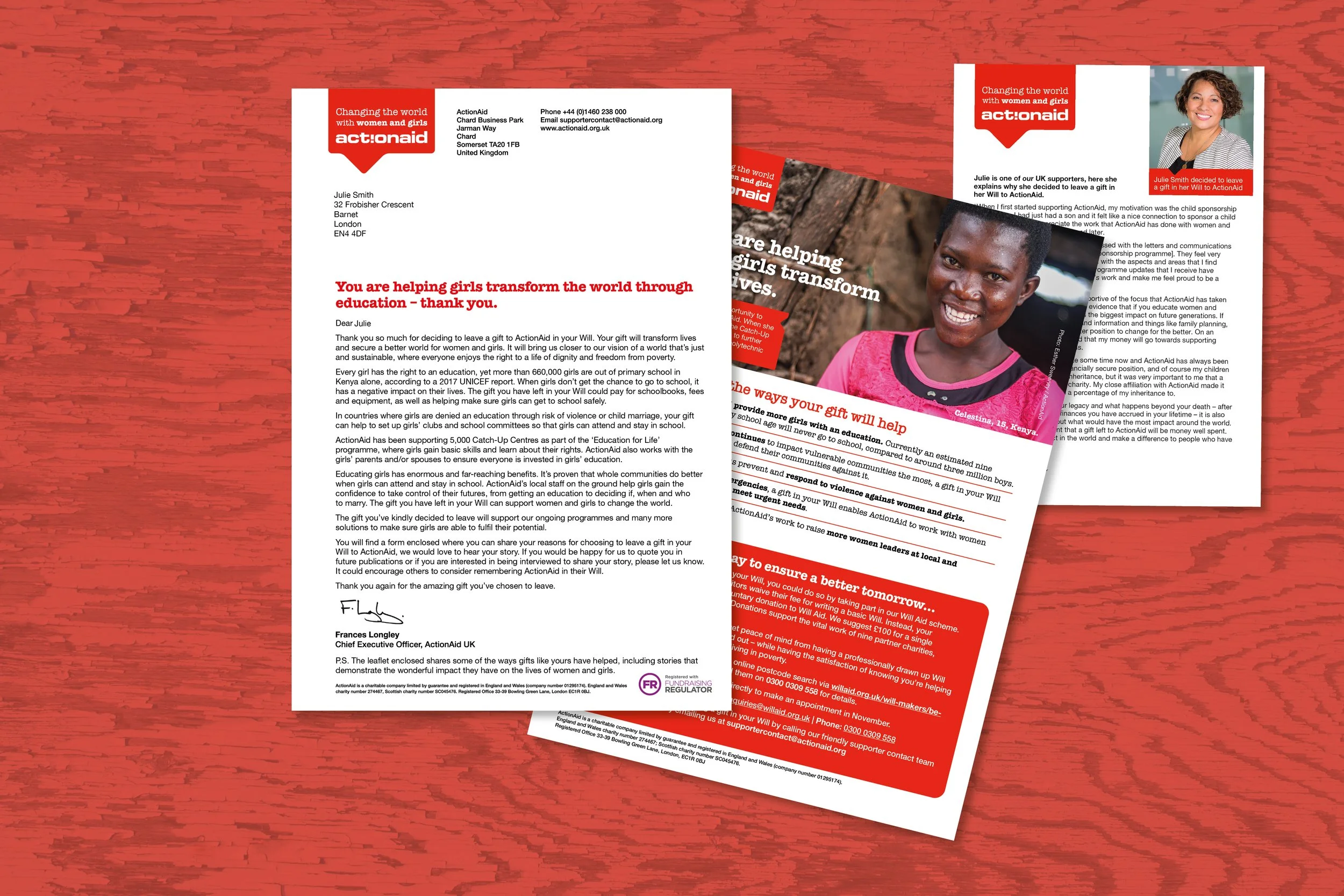 Two printed letters or flyers from ActionAid, with red and white branding, featuring a woman's face, smiling, and promoting education and support for girls' empowerment, placed on a wooden surface.