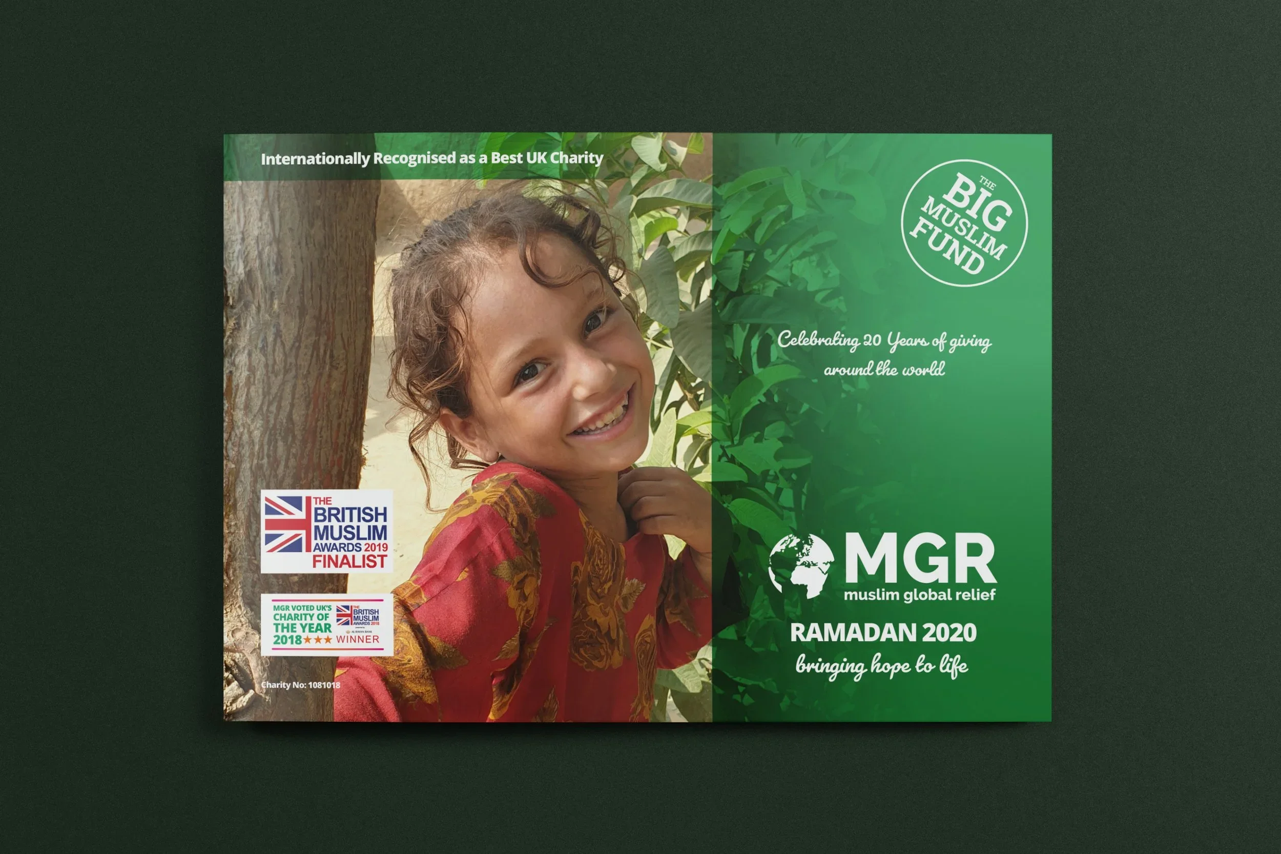 Charity flyer featuring a smiling young girl with curly hair, standing by a tree, promoting Muslim global relief charity, MGR. The flyer highlights awards and recognition received, including British Muslim Awards finalist, charity of the year 2018 wi