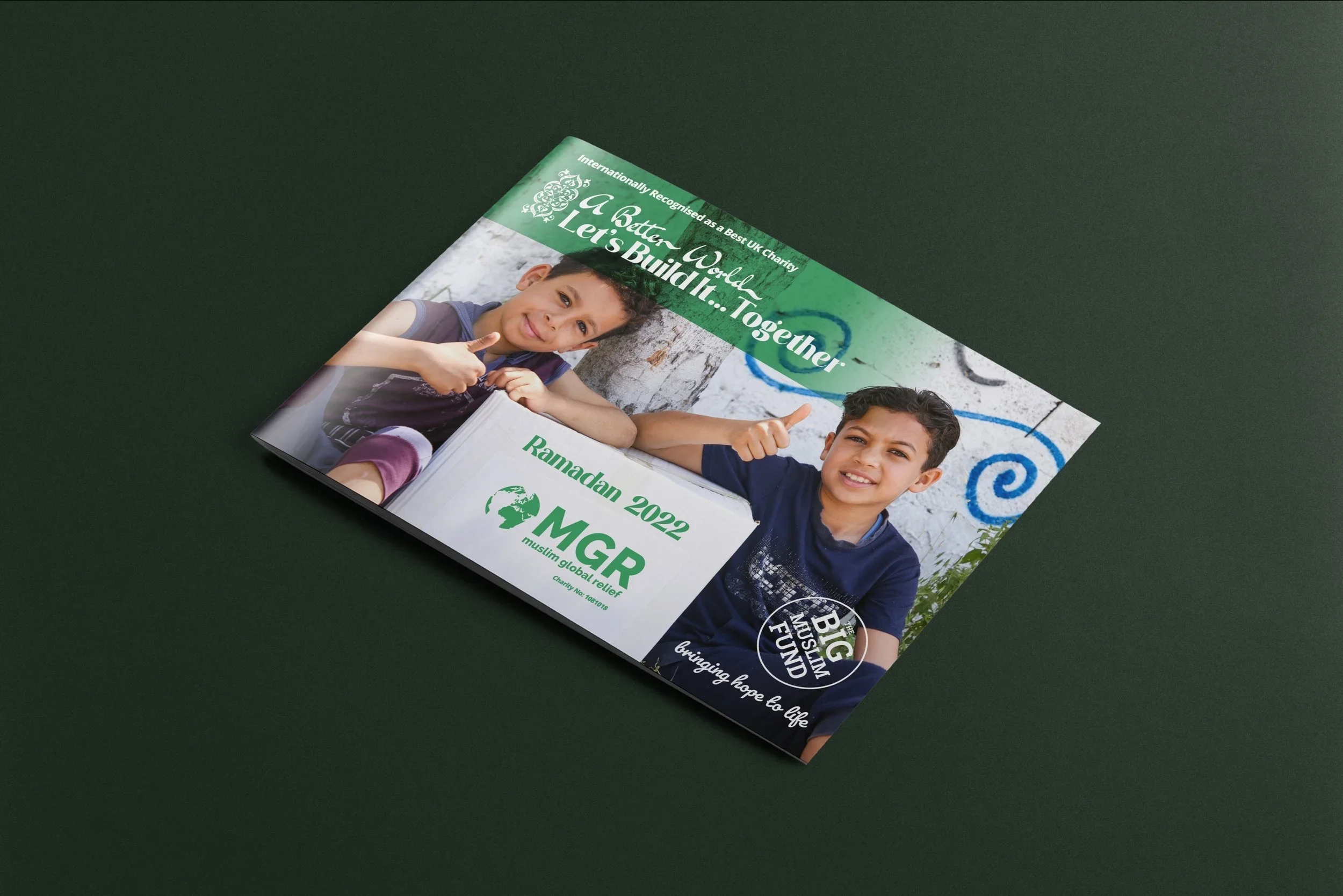 A flyer promoting a charity event for Ramadan 2022 by Muslim Global Relief, featuring two smiling boys, one giving a thumbs-up and the other making a gesture, with text indicating 'Let's Build It... Together' and 'Bringing Hope to Life.'
