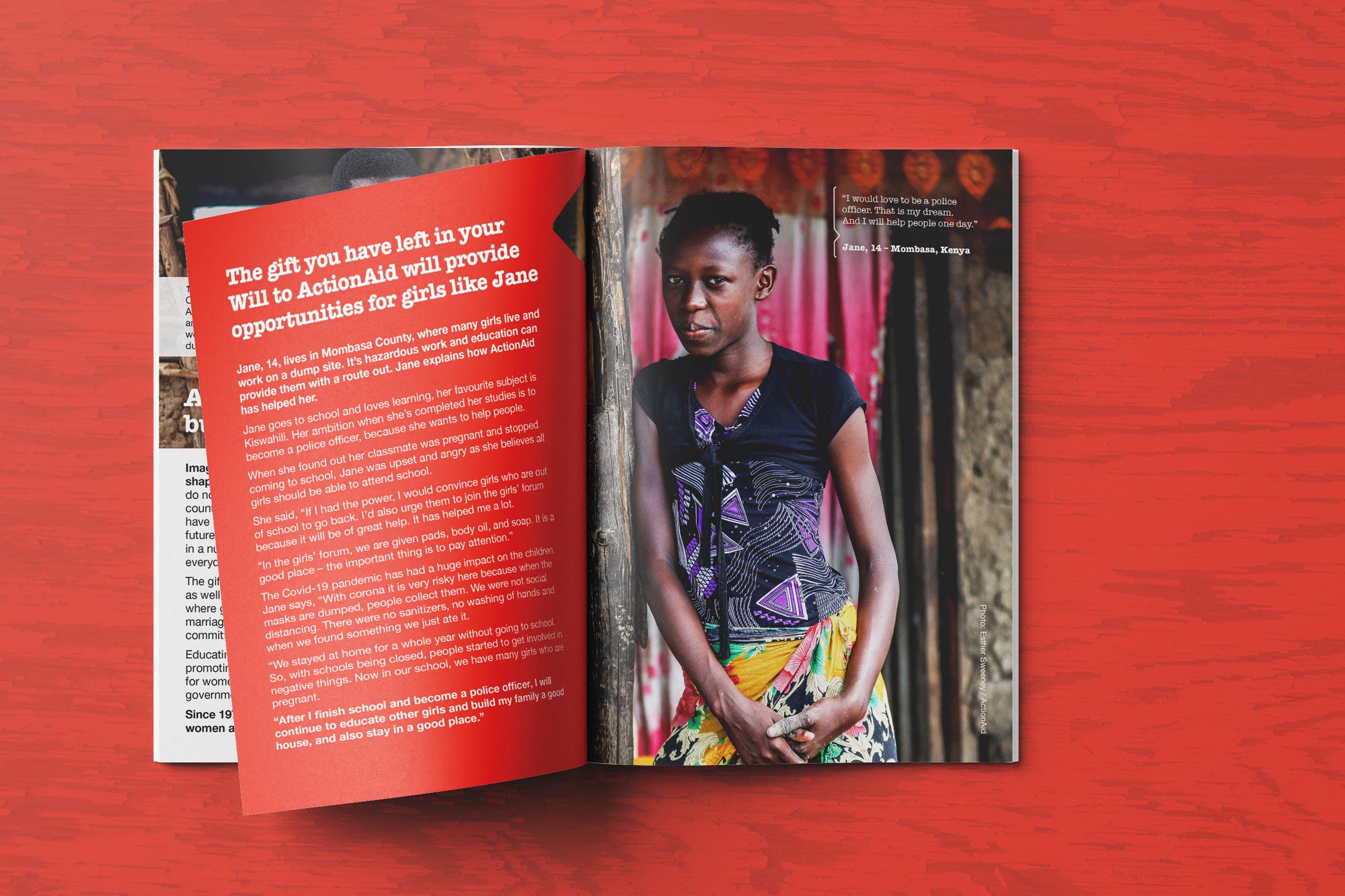 Open magazine featuring a young girl with short hair, wearing a black top and a colorful skirt, standing indoors next to a wooden pole. Opposite page has a red background with white text highlighting a story about a girl named Jane from Mombasa, Keny