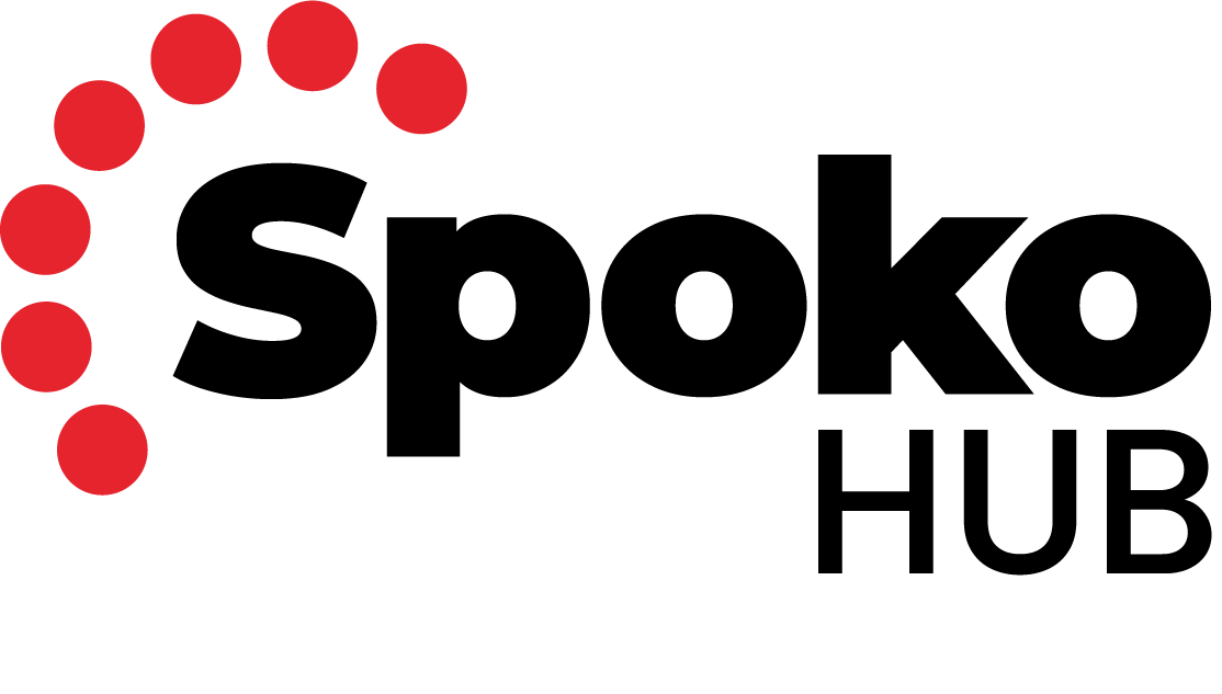 A handwritten note on a white paper with a red dot pattern in the top left corner.