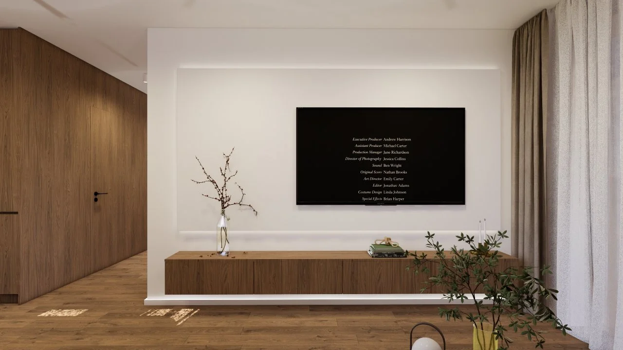 Modern living room with a wooden sideboard, a large wall-mounted TV, a glass vase with a branch, some books, a leafy plant, and curtains.