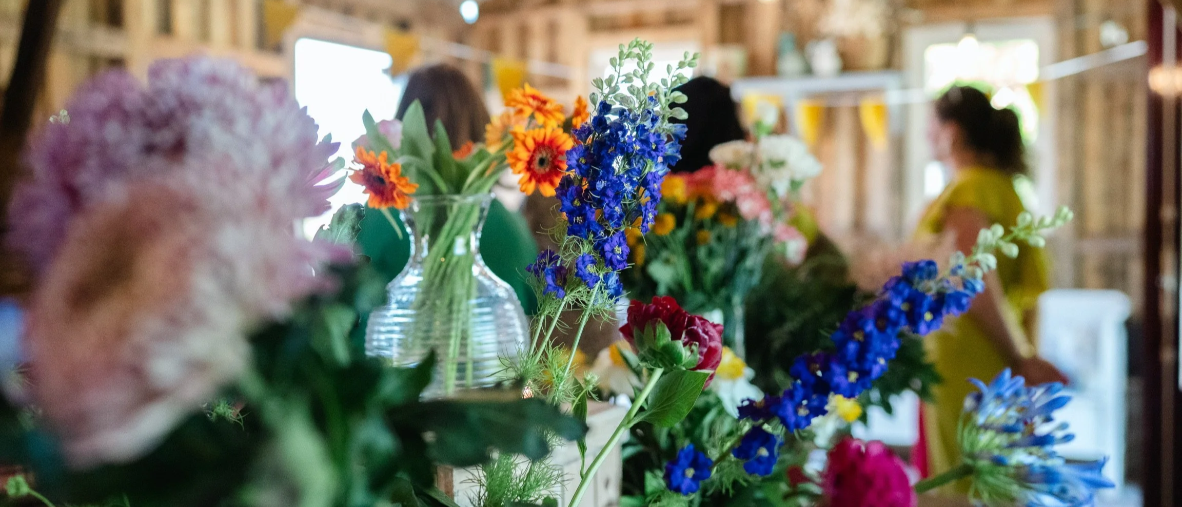 different kind of flowers styled in a room