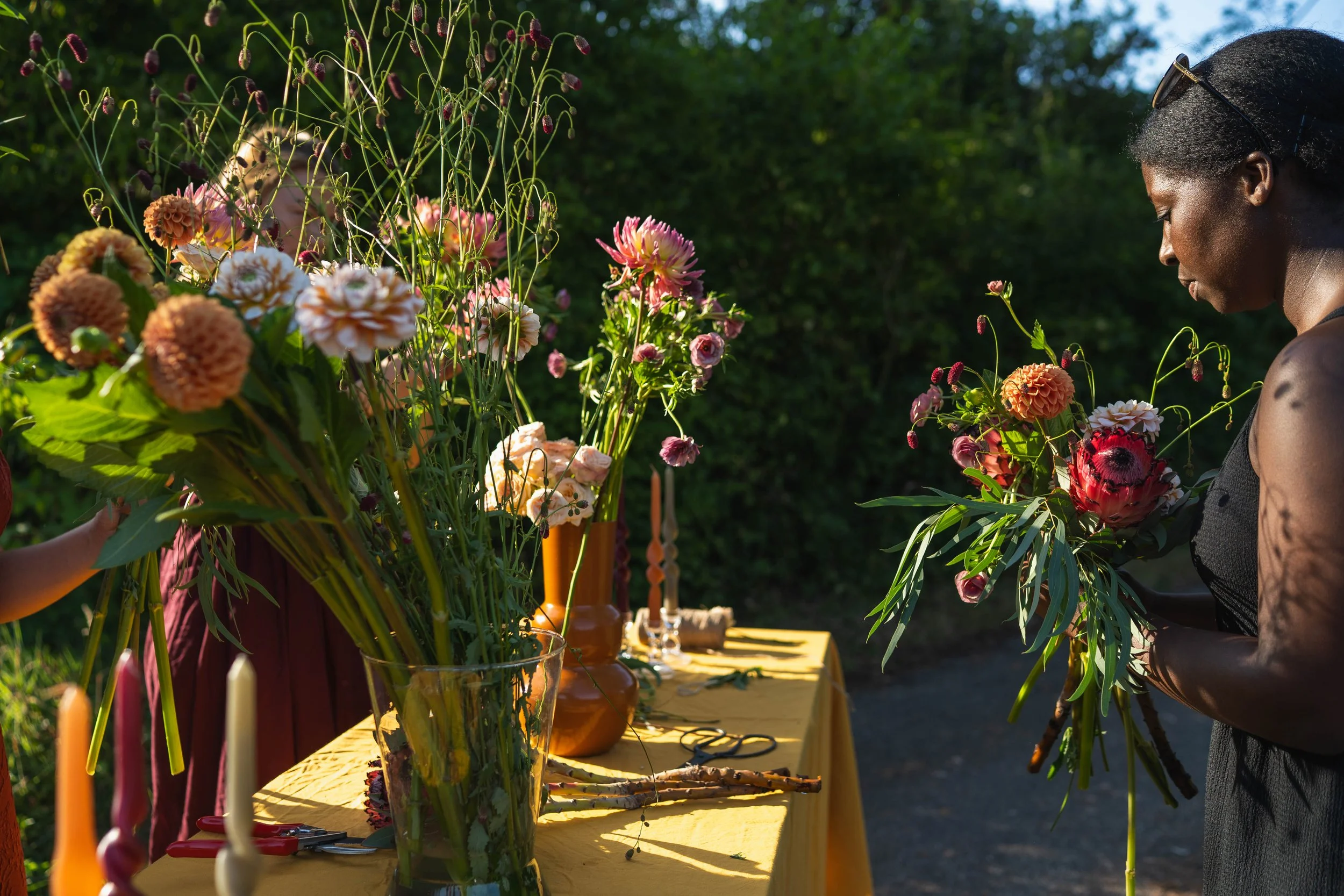 Manuela Lammers-Kyereh arranging seasonal flowers at MK Floral Atelier