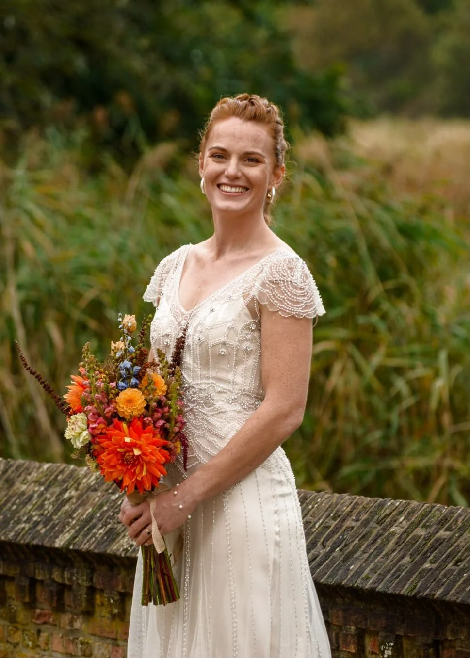 Bridal bouquet with orange dahlias by MK Floral Atelier, wedding ceremony flowers Zoetermeer