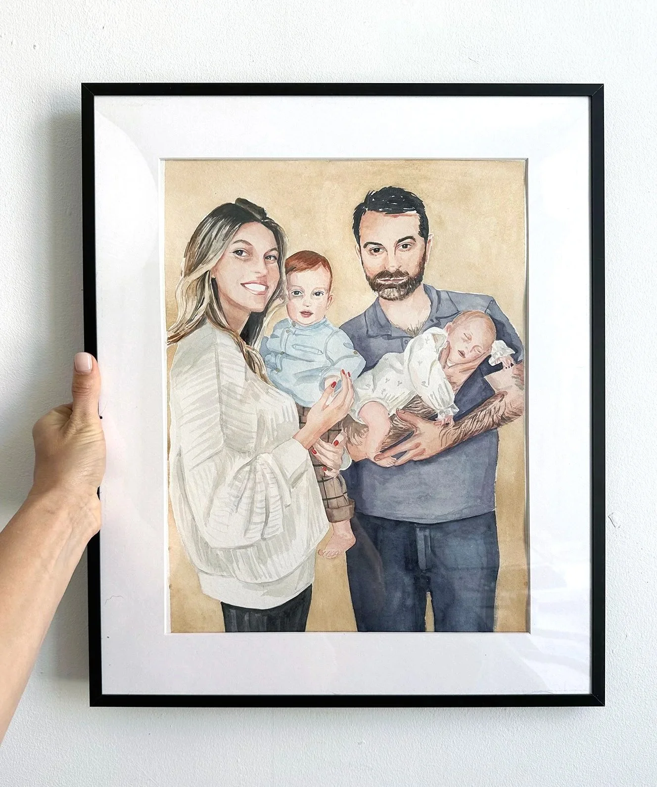 Watercolor portrait of a family of four, including a woman, a man, a young boy, and a newborn baby.