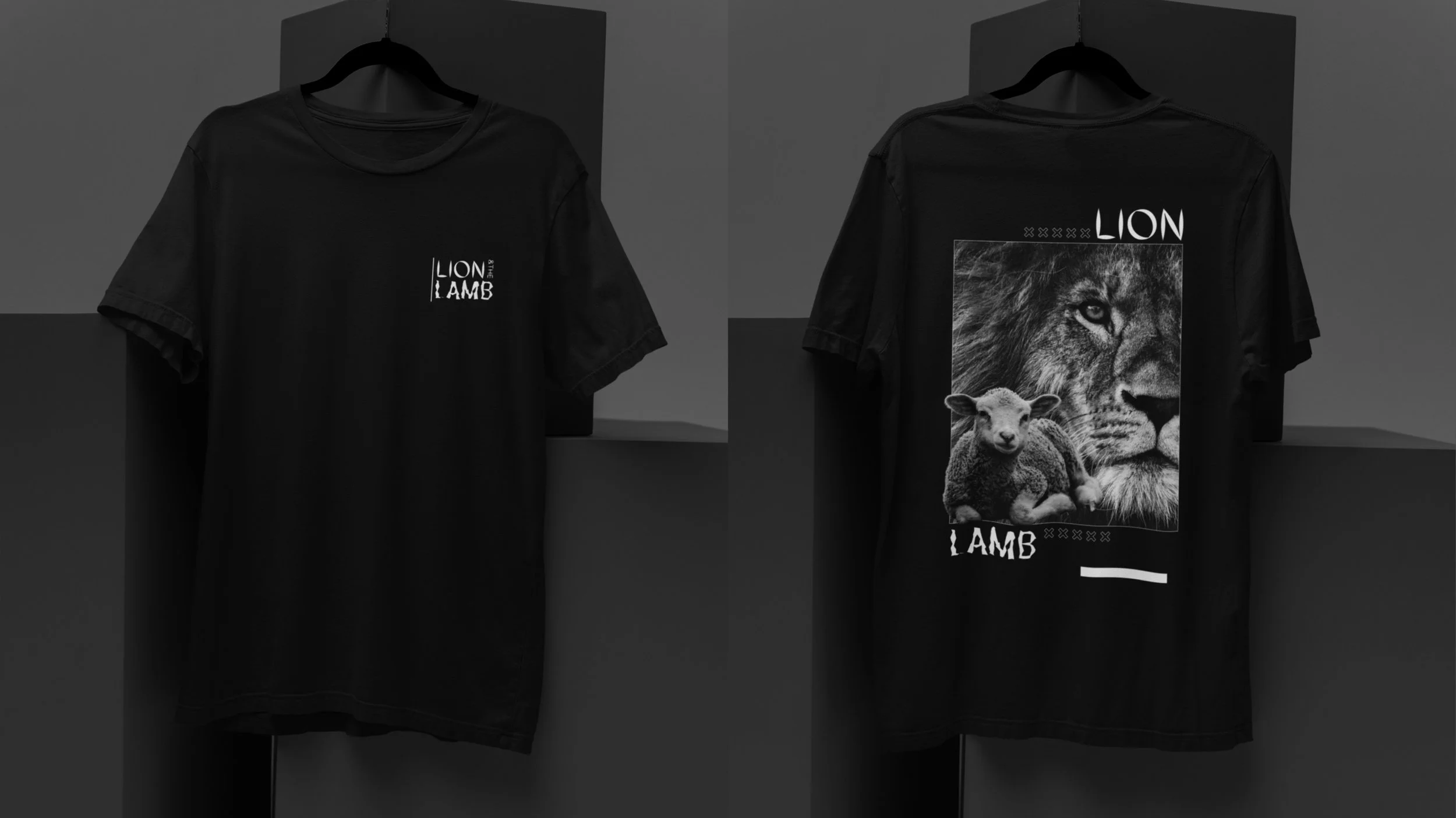 Black T-shirts hanging on black hangers against a black background; one shirt has the text 'LION THE LAMB' on the front, and the other has a large graphic of a lion's face with a smaller lamb, and the text 'LION' and 'LAMB' written on the back.