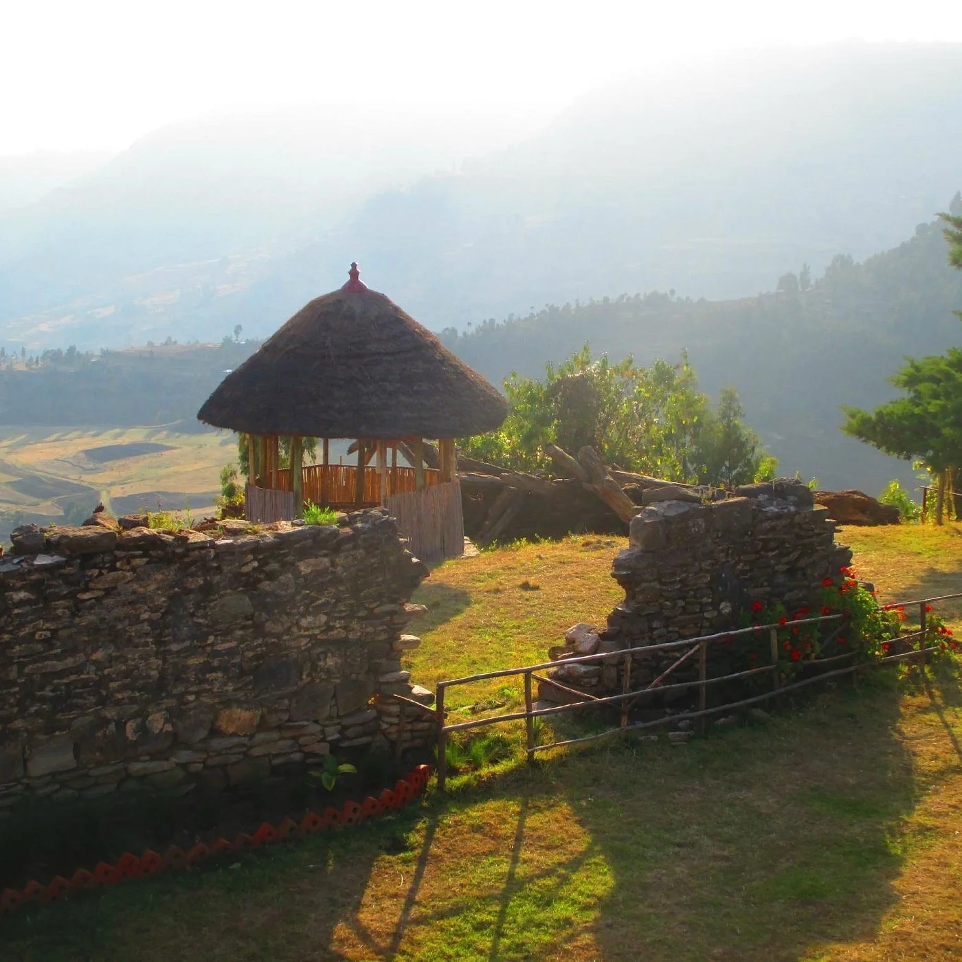 Traditional lodge building at Ankober Palace Lodge overlooking the Ethiopian highlands.