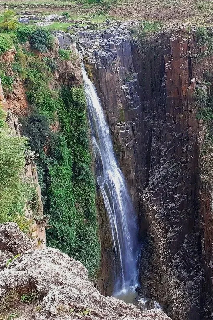 Waterfall flowing through a rocky gorge in northern Ethiopia, highlighting the importance of watershed protection and water conservation.