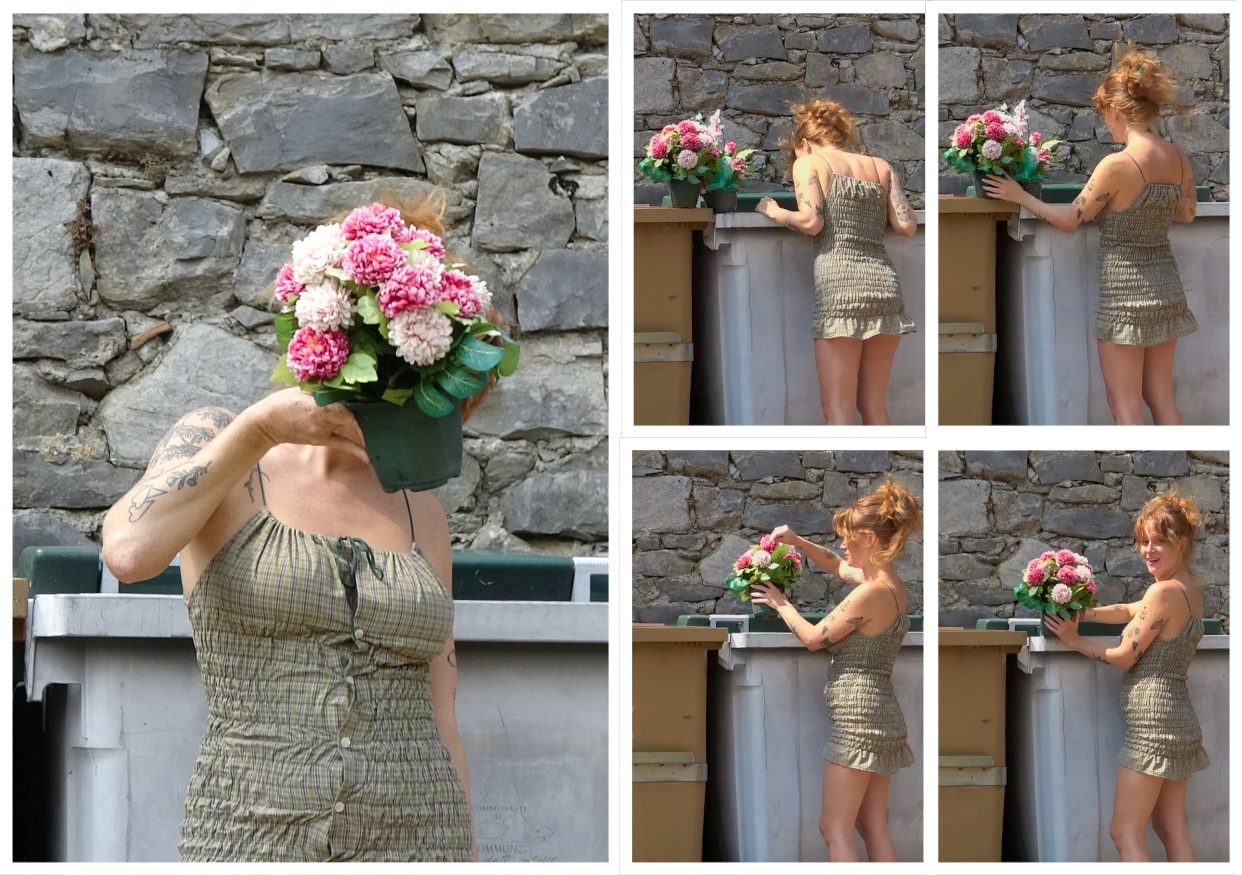Une femme aux cheveux roux en situation décontractée pose près d'une structure en pierre, tenant un bouquet de fleurs roses et blanches. La scène se déroule en extérieur, avec un mur de pierres en arrière-plan.