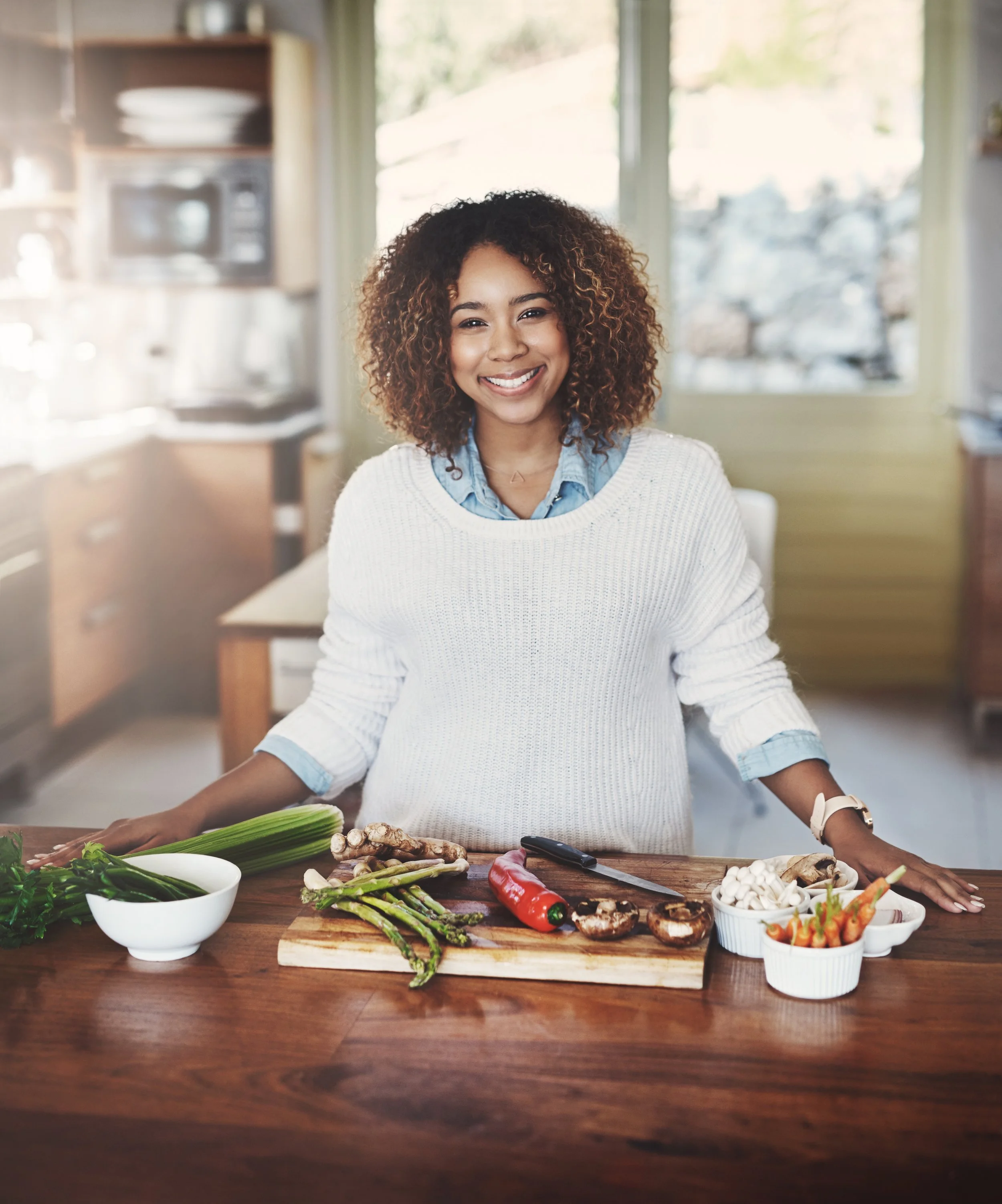woman eating and preparing food healthy - peptides, GLP1 metabolic suppor - lifestyle integration