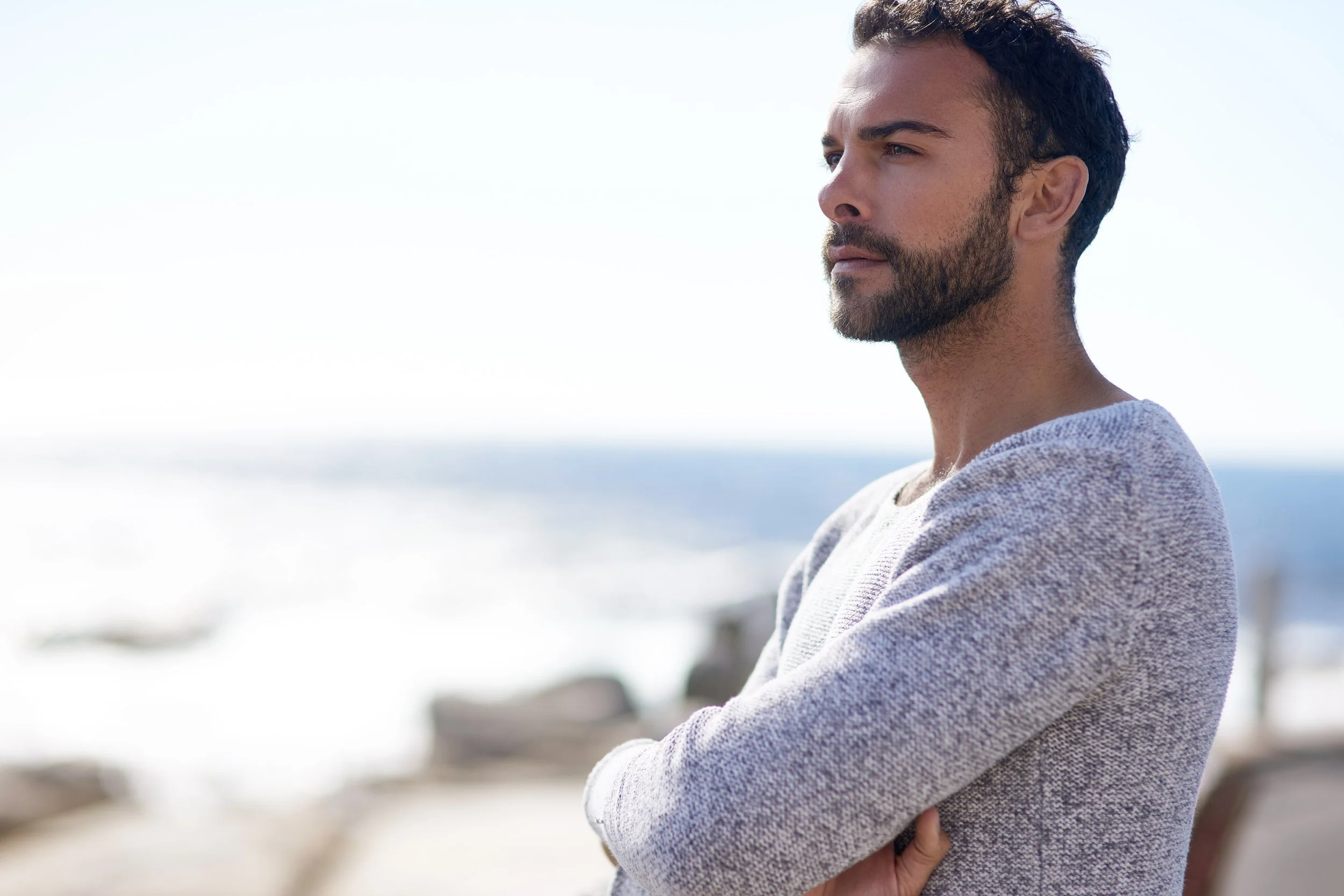 young healthy fit man outdoor looking at the horizon