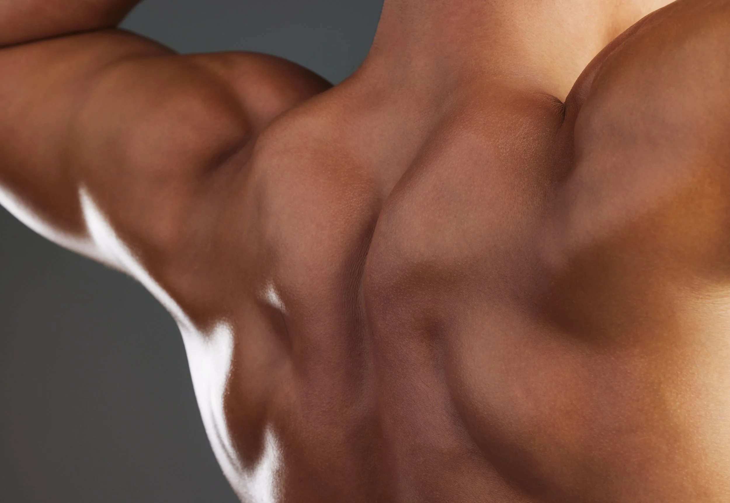 back of a man showing his muscles