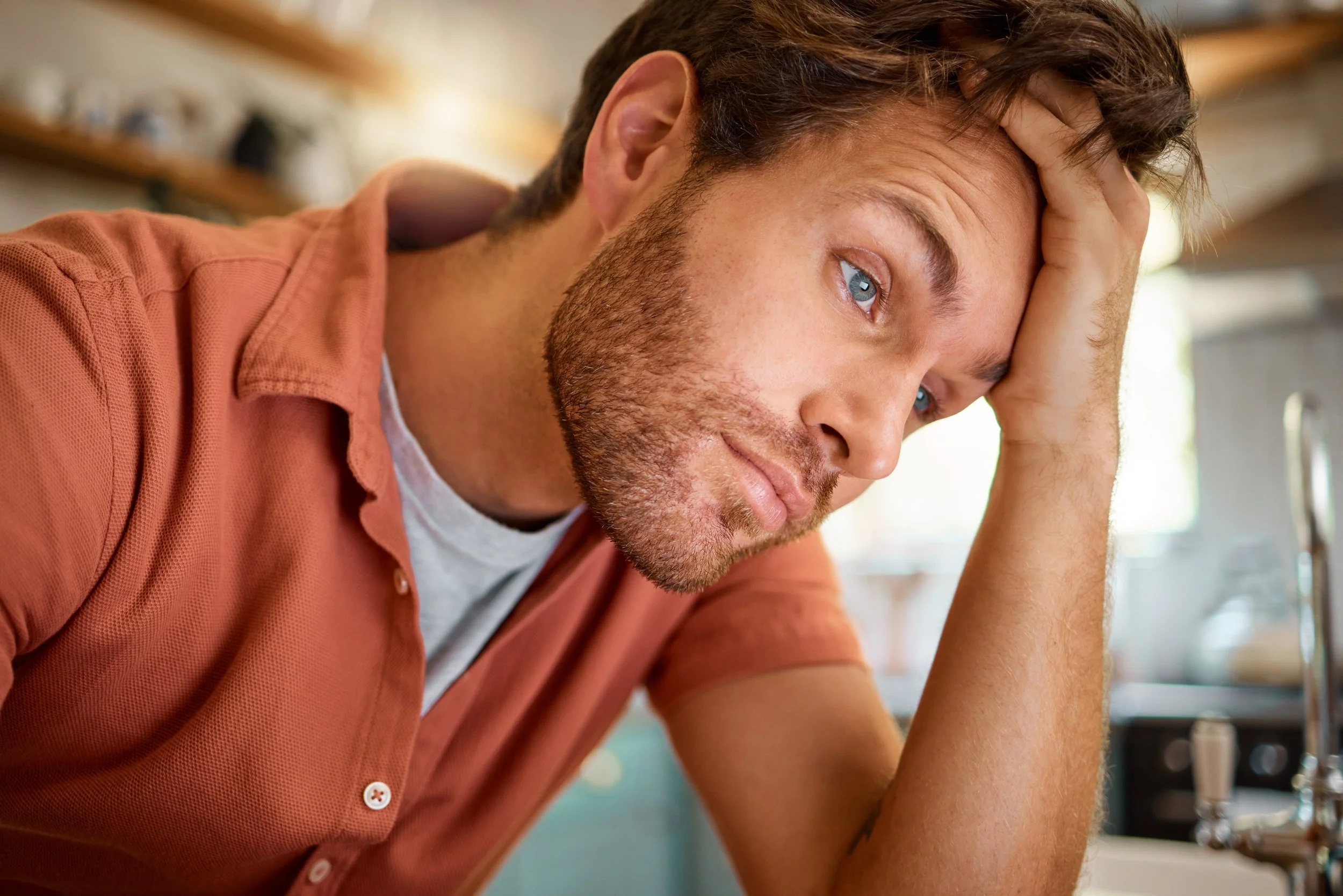 young tired businessman holding his head, fatigue