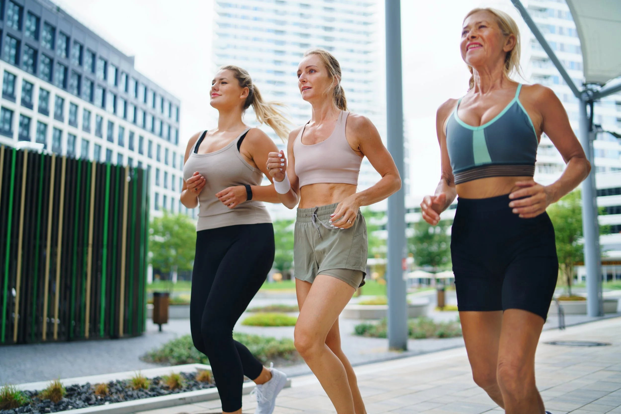 group of young and old healthy women running outside