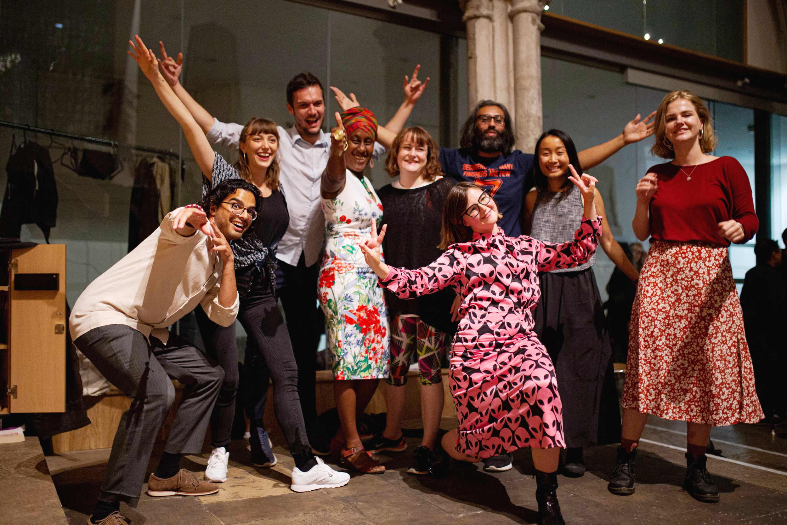 A group of peer-to-peer learners showcase their learning. They smile at the camera!