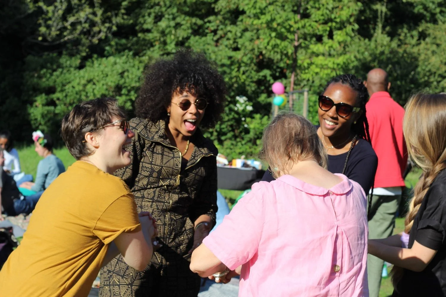 Huddle Camp - Peers laughing on the lawn