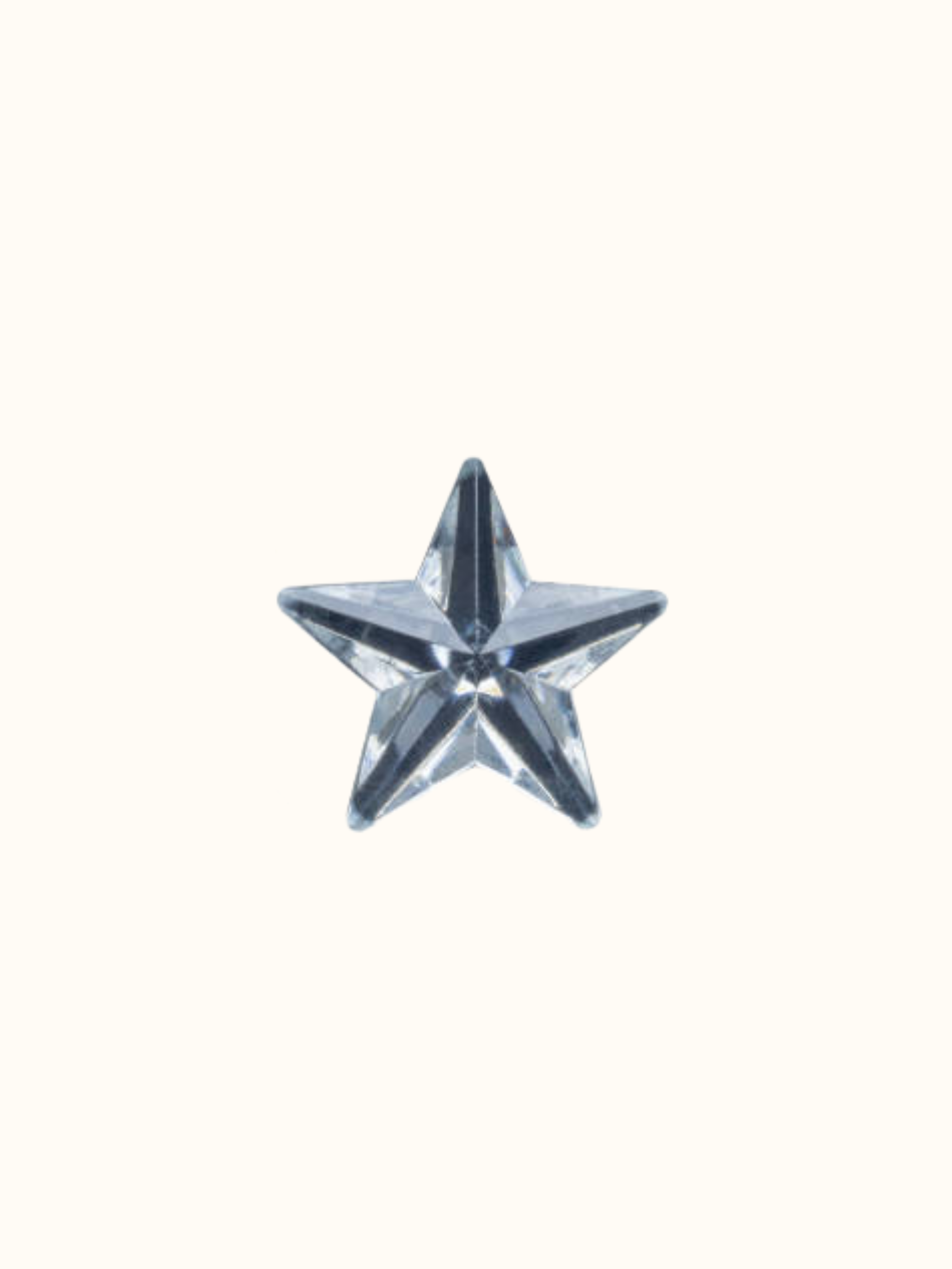 Crystal star-shaped ornament against a plain background.