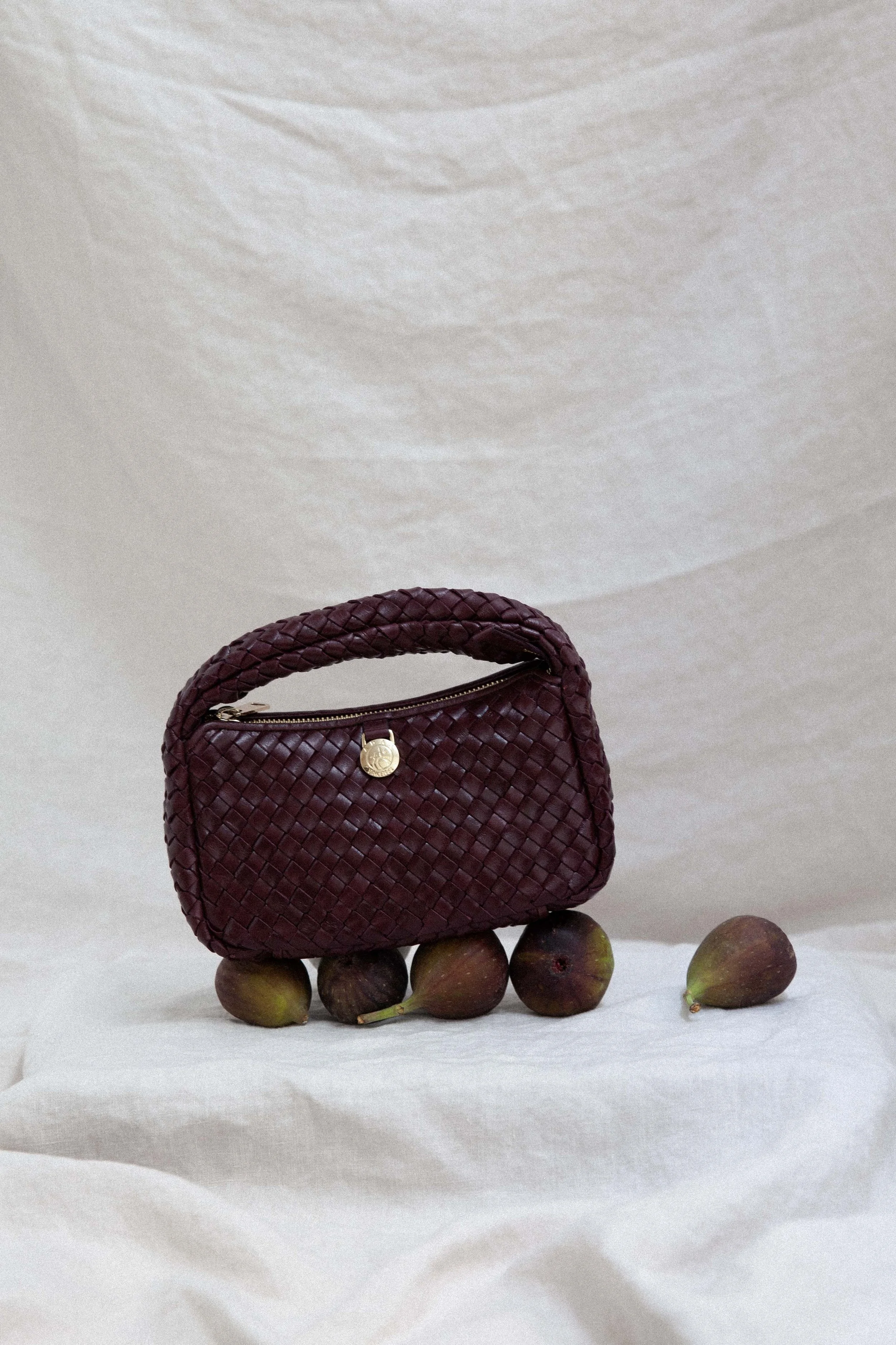 Barolo colored bag from adax copenhagen with figs still life photography