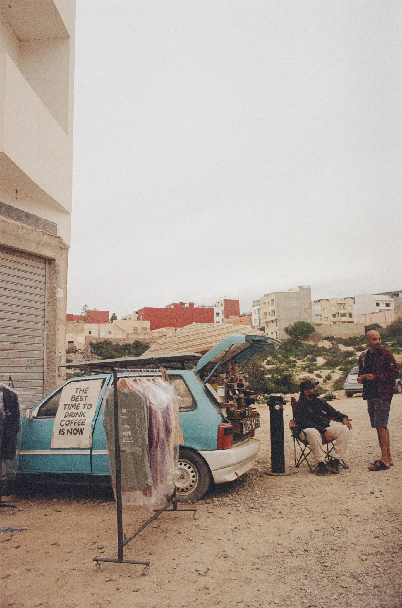Coffee bar in old car on a dirt road in Tamraght Marocco shot on film
