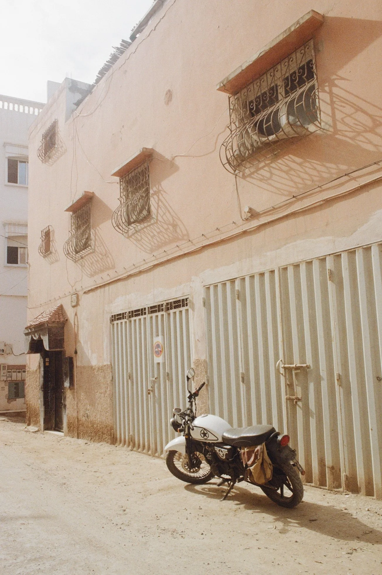 Motorcycle in small village Tamraght in Marocco, shot on film