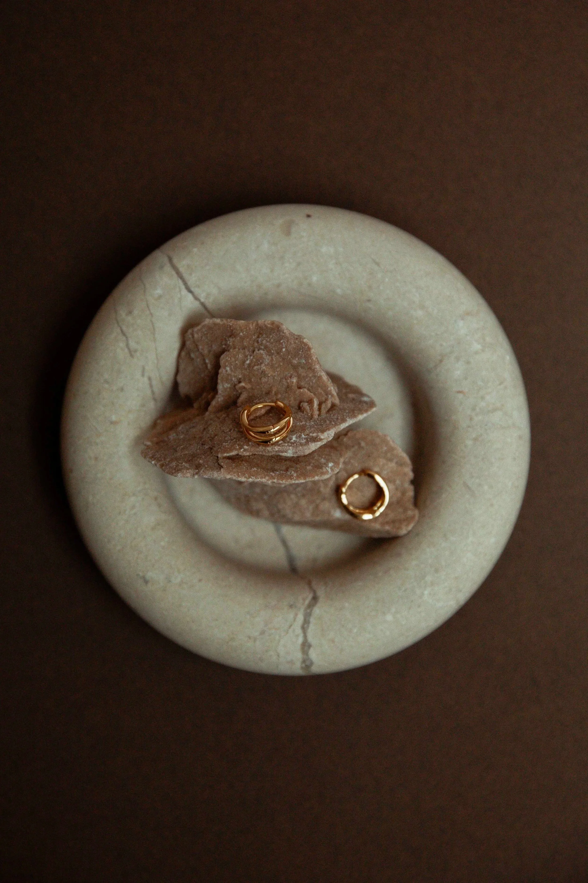 Still life photography gold earrings from Brandlinger