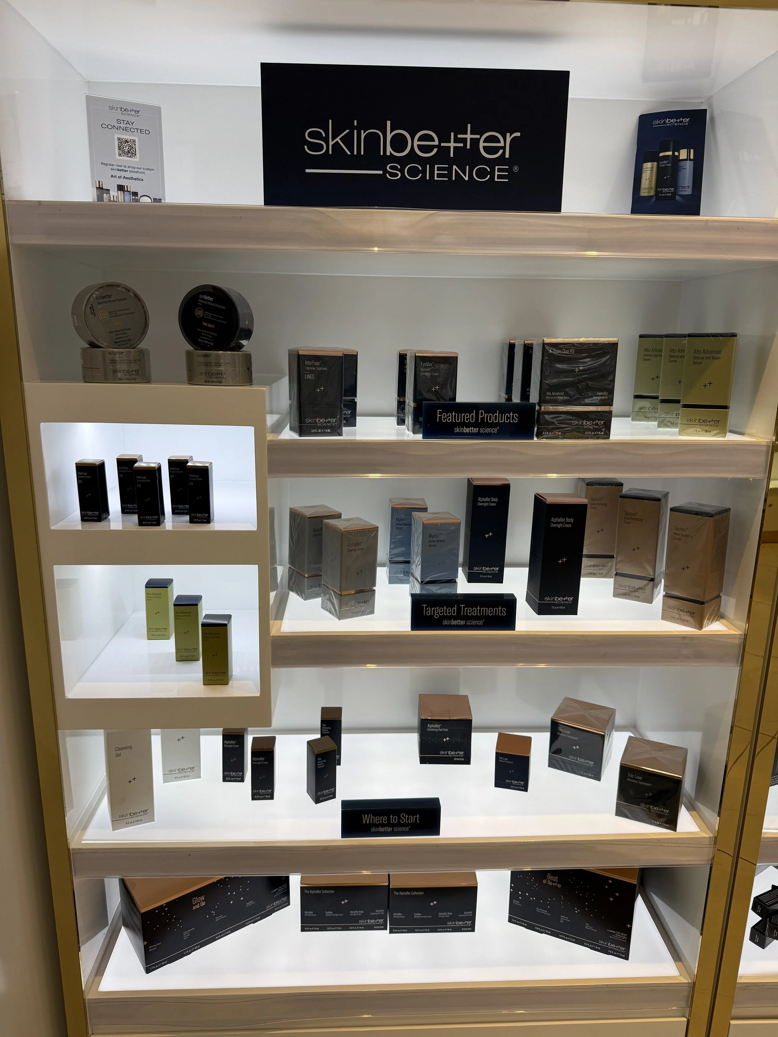 Display shelf with skincare products from SkinBetter Science, labeled as featured products, targeted treatments, and where to start.