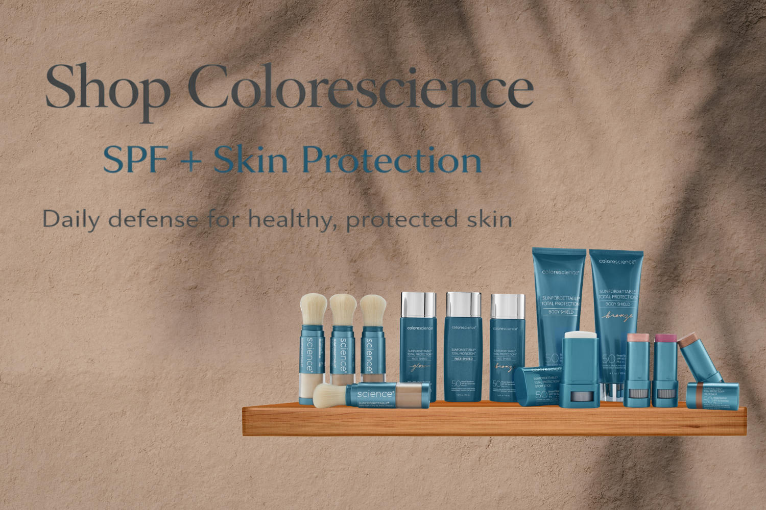 Display of Colorescience skincare products including brushes, sunscreen, and lip balms on a wooden shelf with text promoting SPF and skin protection.