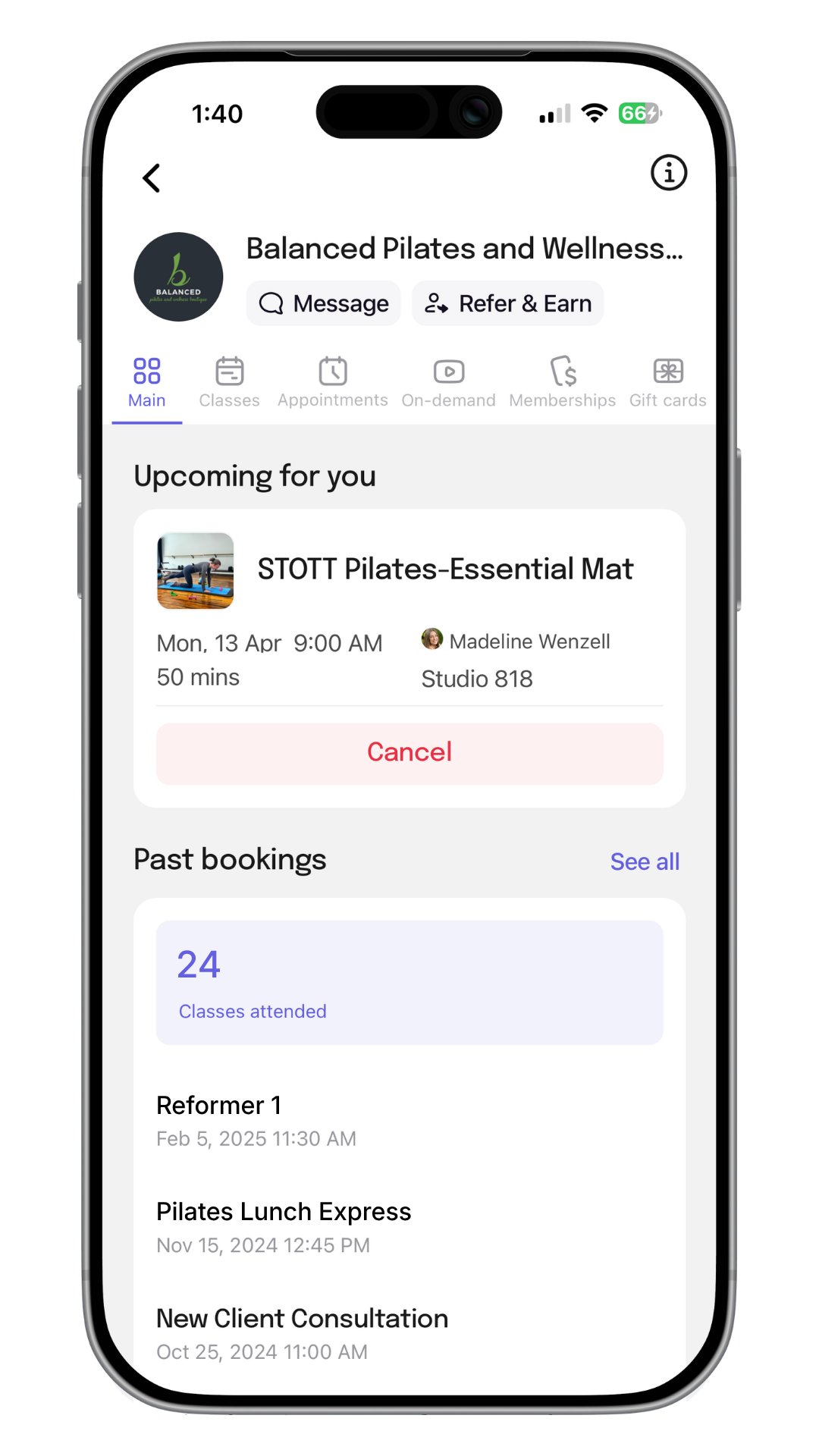 A smartphone screen displaying a fitness studio app named Balanced Pilates and Wellness. The screen shows upcoming class details for a Pilates session, past bookings, and options like message and refer & earn.