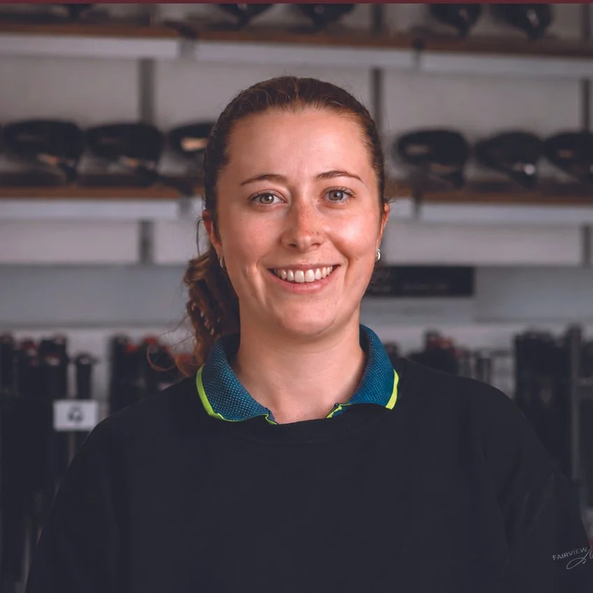 Fairview Mountain Golf Club associate professional Sam Copeland smiling in the fitting bay.