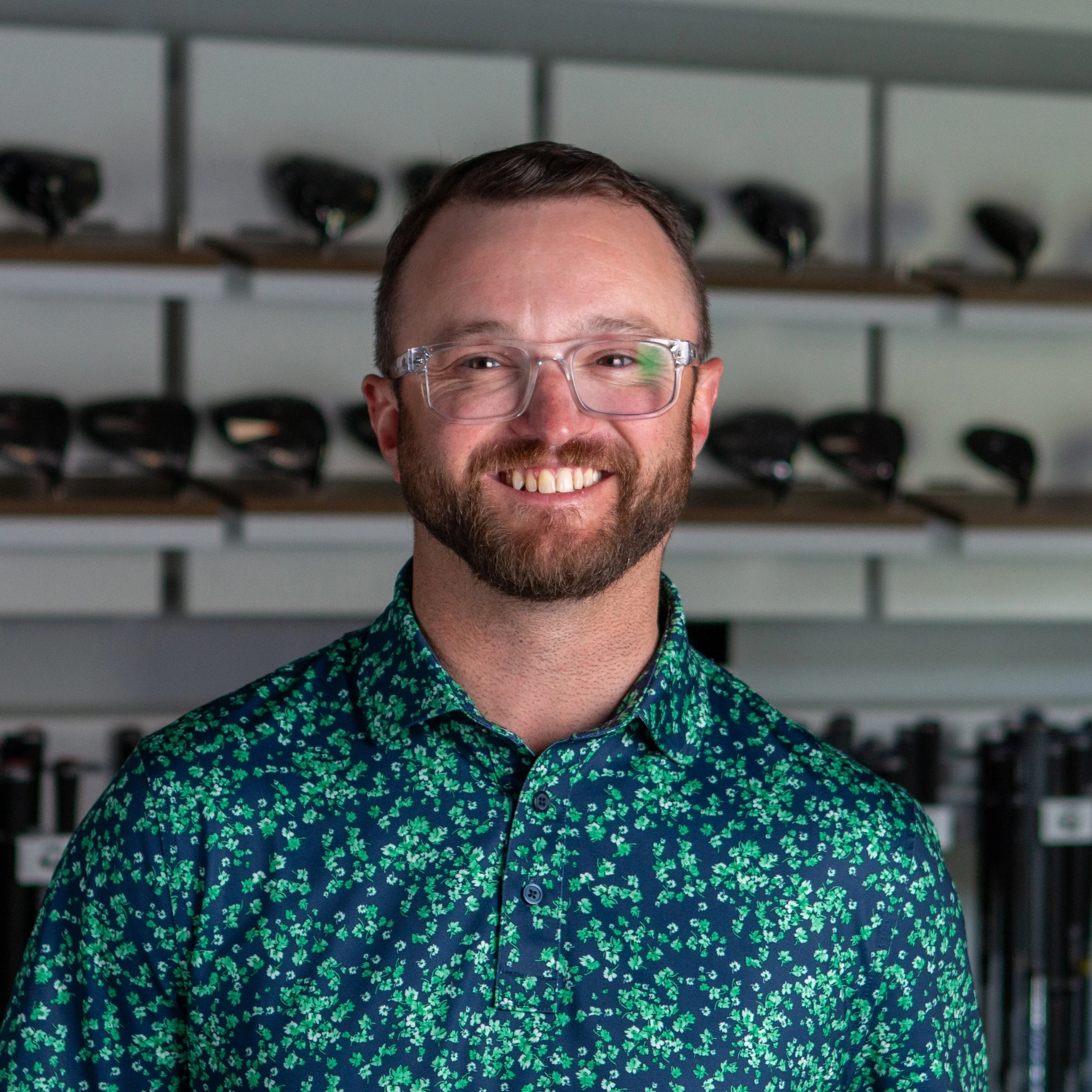 Fairview Mountain Golf Club associate professional Kevin Schultz smiling in the fitting bay.