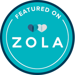 Circular badge with the text "Featured on Zola" and a design of three hearts above the text