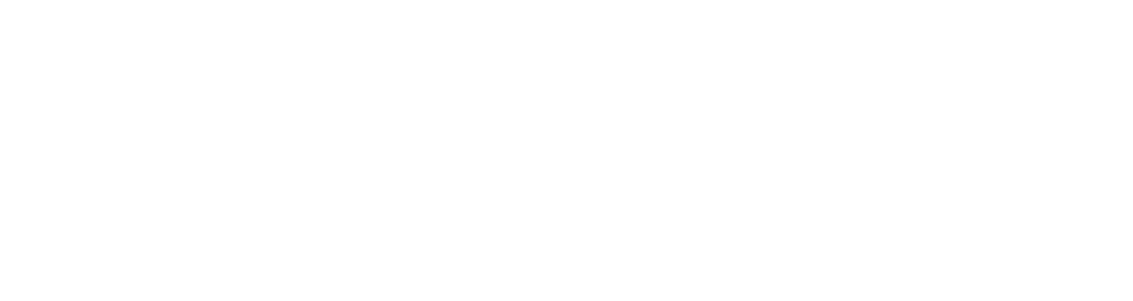 Ornate white decorative design on black background, featuring symmetrical swirling patterns.