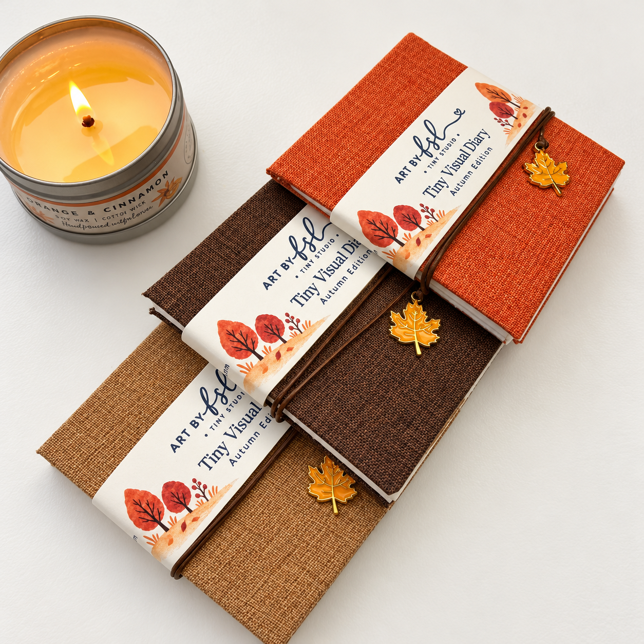 1. Three autumn diaries and a candle.png