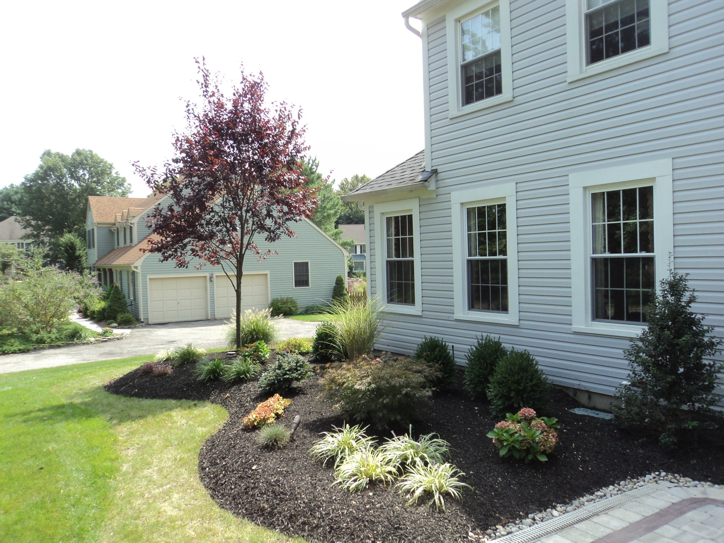 Wayne, NJ: Create Multi-Level Landscapes With a Custom Retaining Wall and Plantings