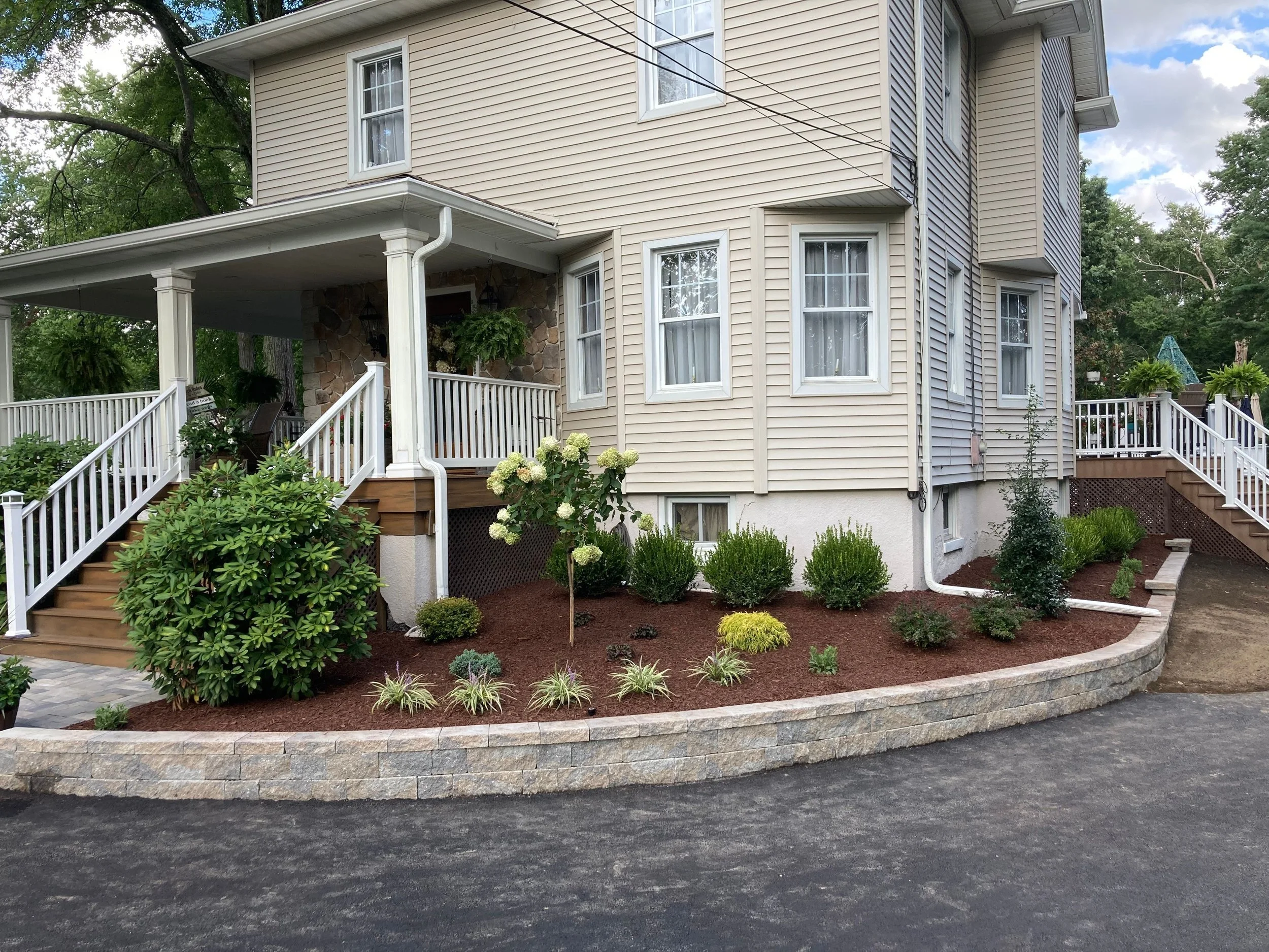 How to Utilize Plantings to Soften a Retaining Wall in the Saddle River, NJ, Area