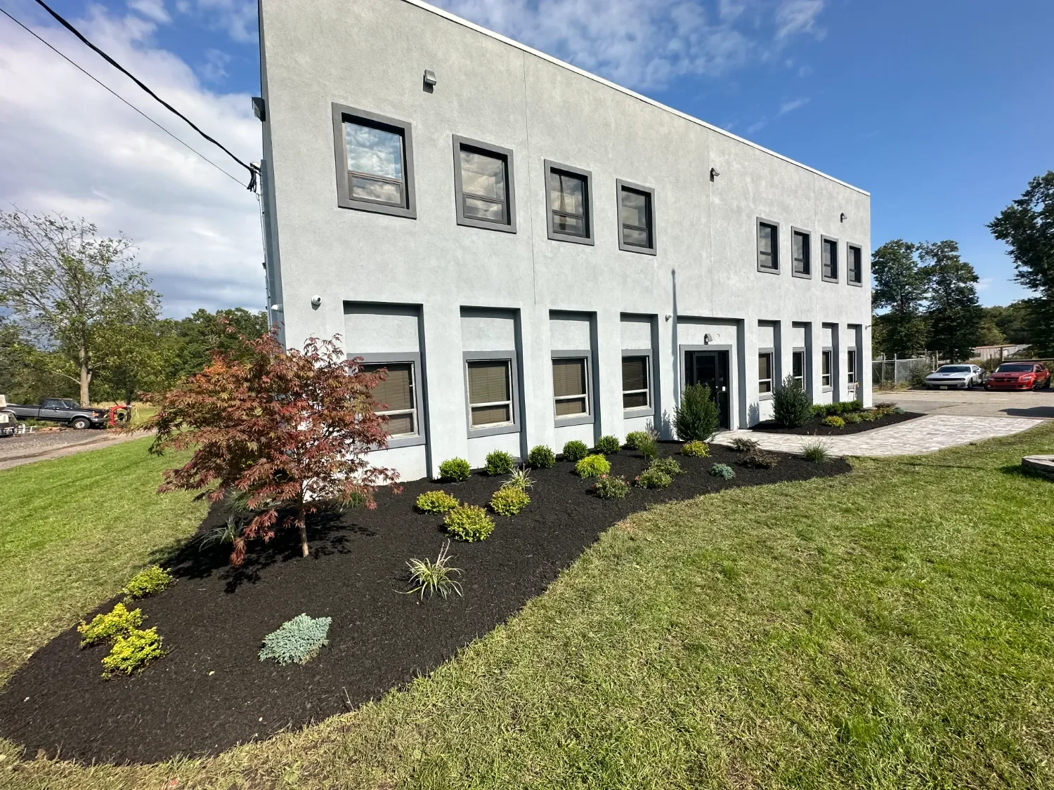 Commercial property with lush plantings. - Green Nature Landscape Design