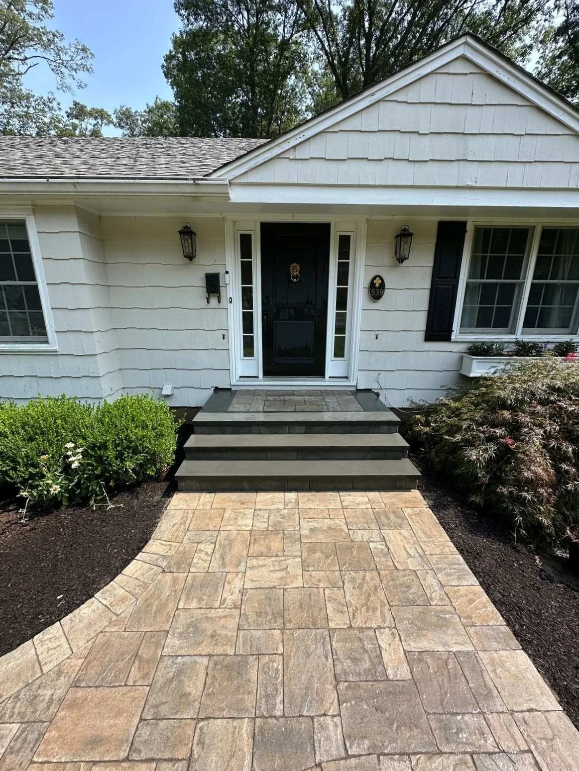 Driveway contractor creating a custom paver driveway and walkway. — Green Nature Landscape Design