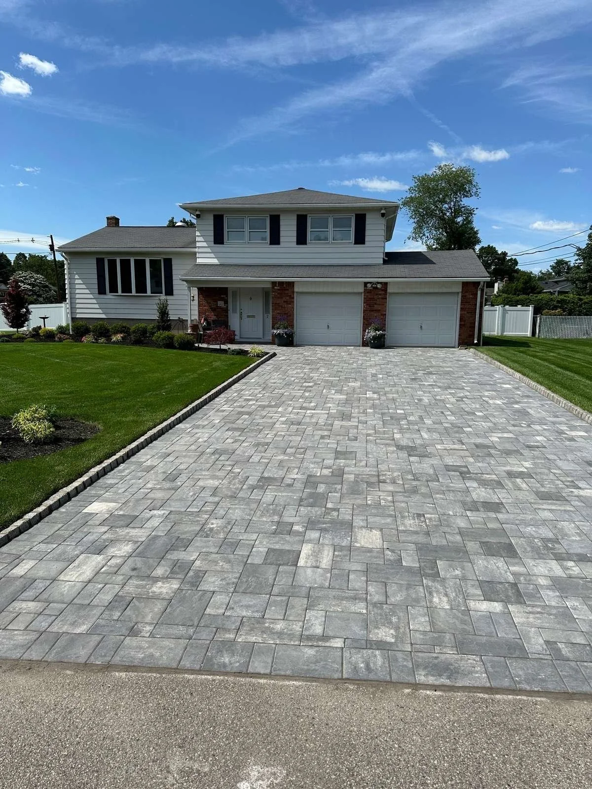 Paver driveway installation completed by an experienced professional driveway contractor. — Green Nature Landscape Design