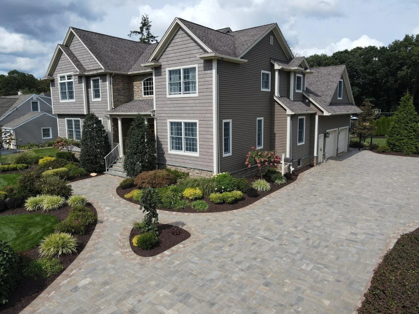 Durable paver driveway and landscape renovation project. — Green Nature Landscape Design